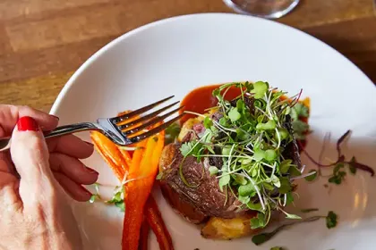 Enjoying a delicious steak dinner