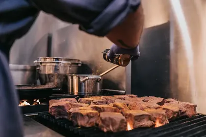 Chef searing steaks