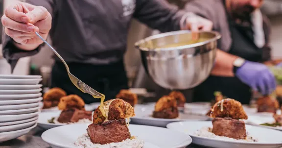 applying garnish to steaks